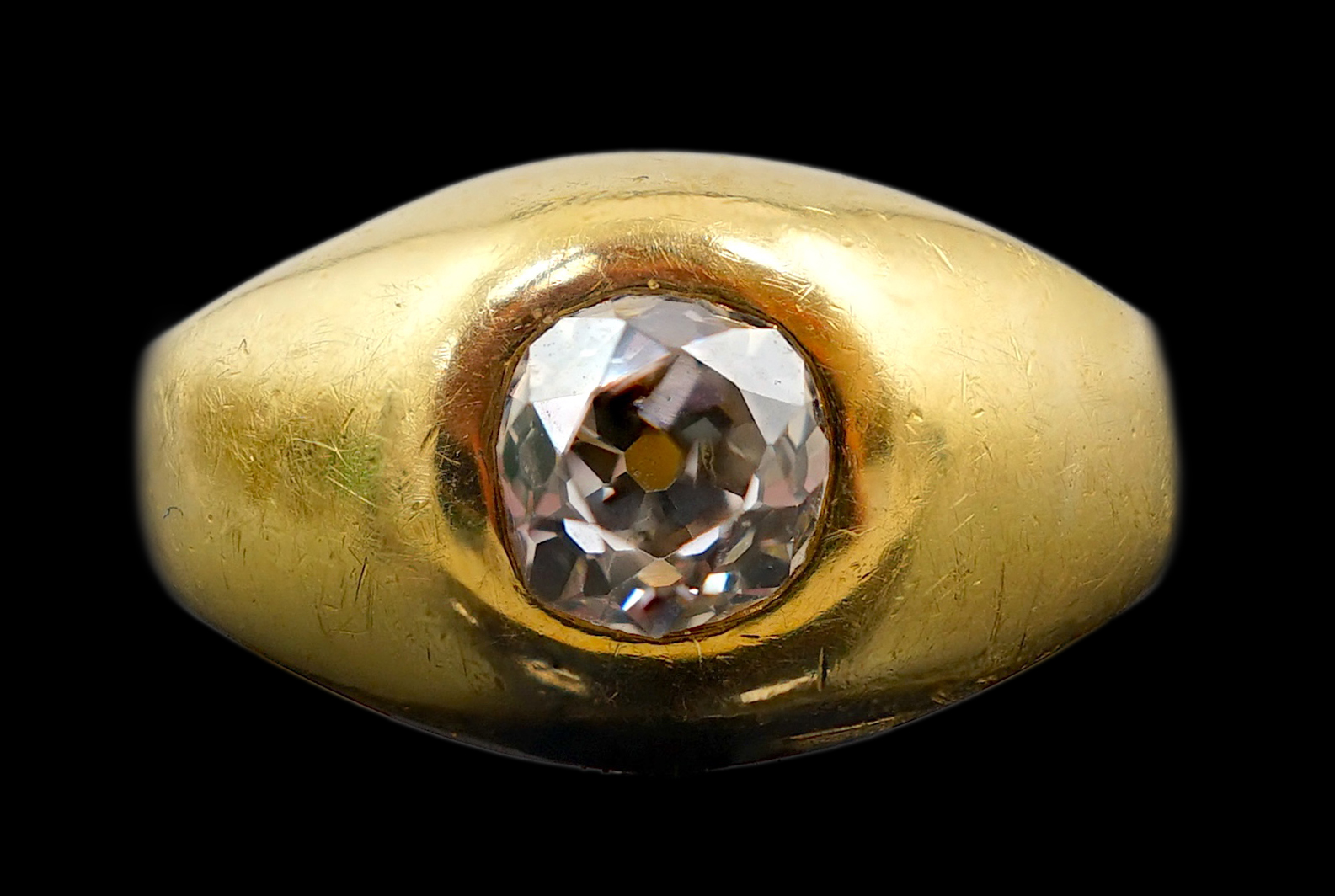 A gold and gypsy set old round cut diamond ring